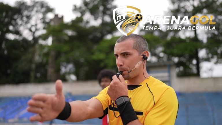 Referee whistling to start or ending soccer match